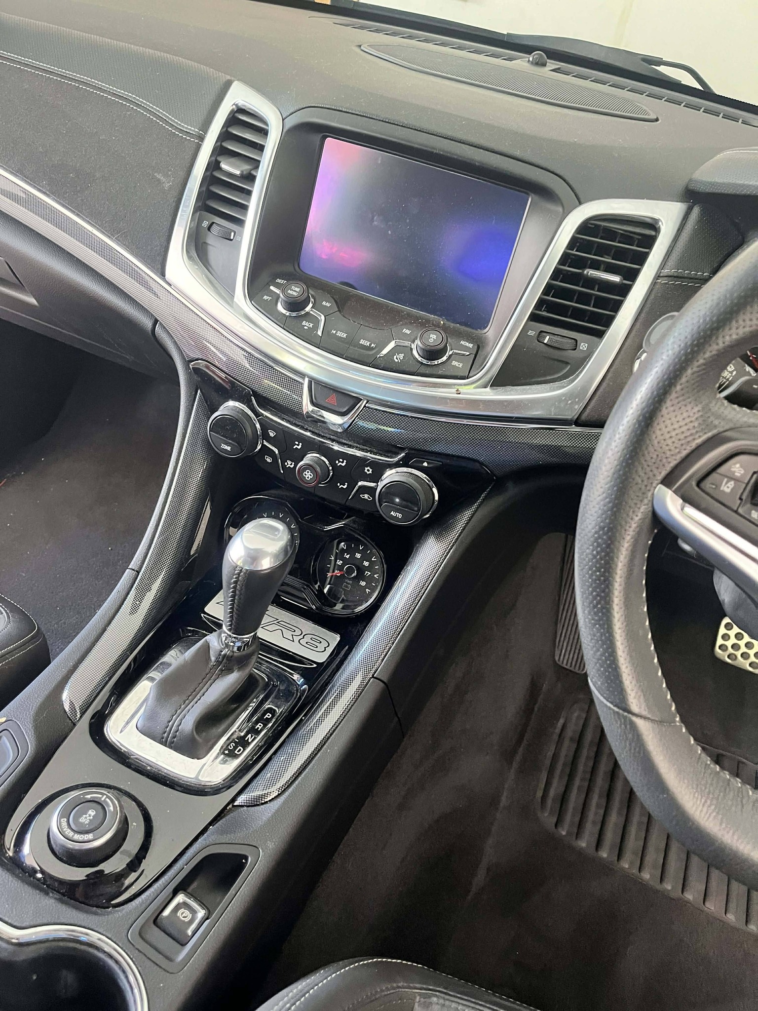 HSV interior — console and R8 badge detailed
