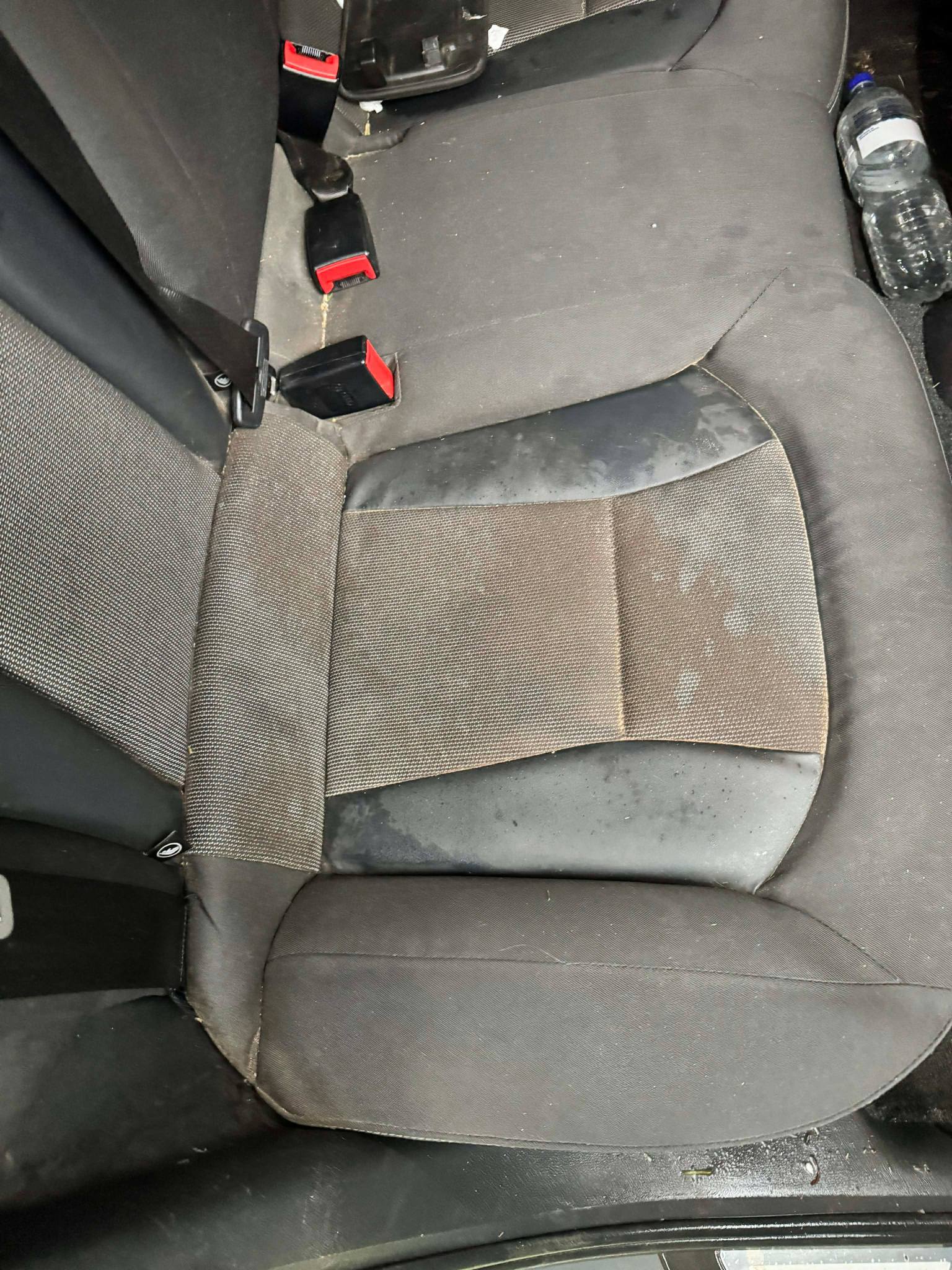 Rear seats before — stained and dirty